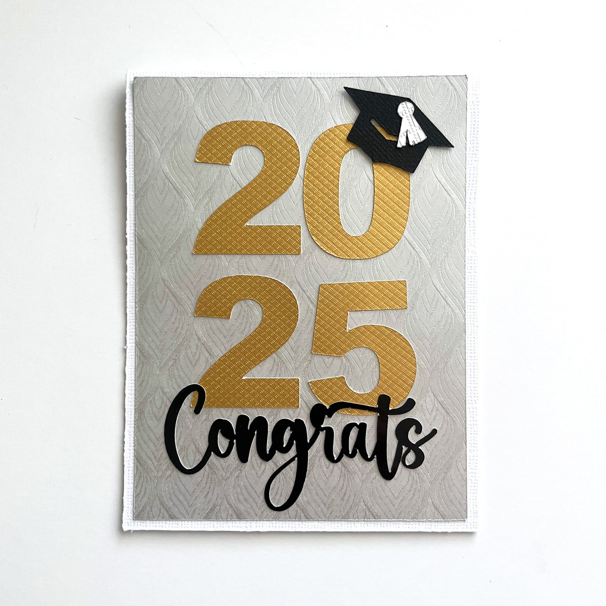 Handmade card featuring embossed foil cardstock by Encore
