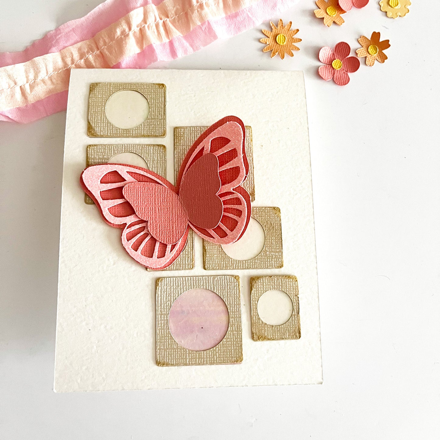 Handmade card featuring a butterfly embellishment