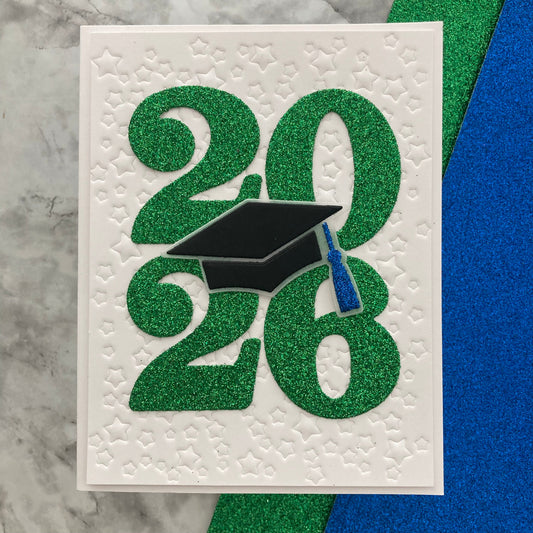 Graduation-themed card with '2026' and a graduation cap on a textured white background.
