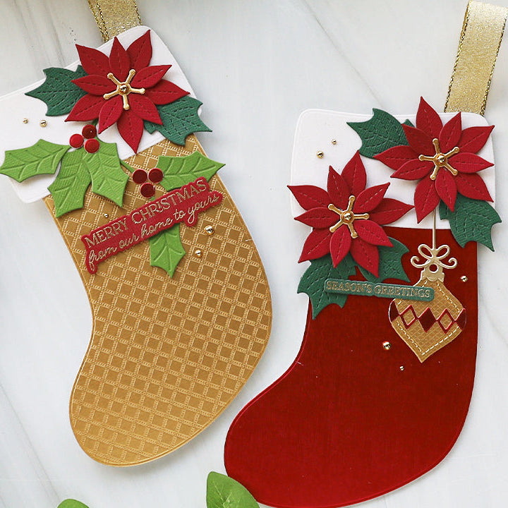 Two Christmas stockings with poinsettias and holly on a white background